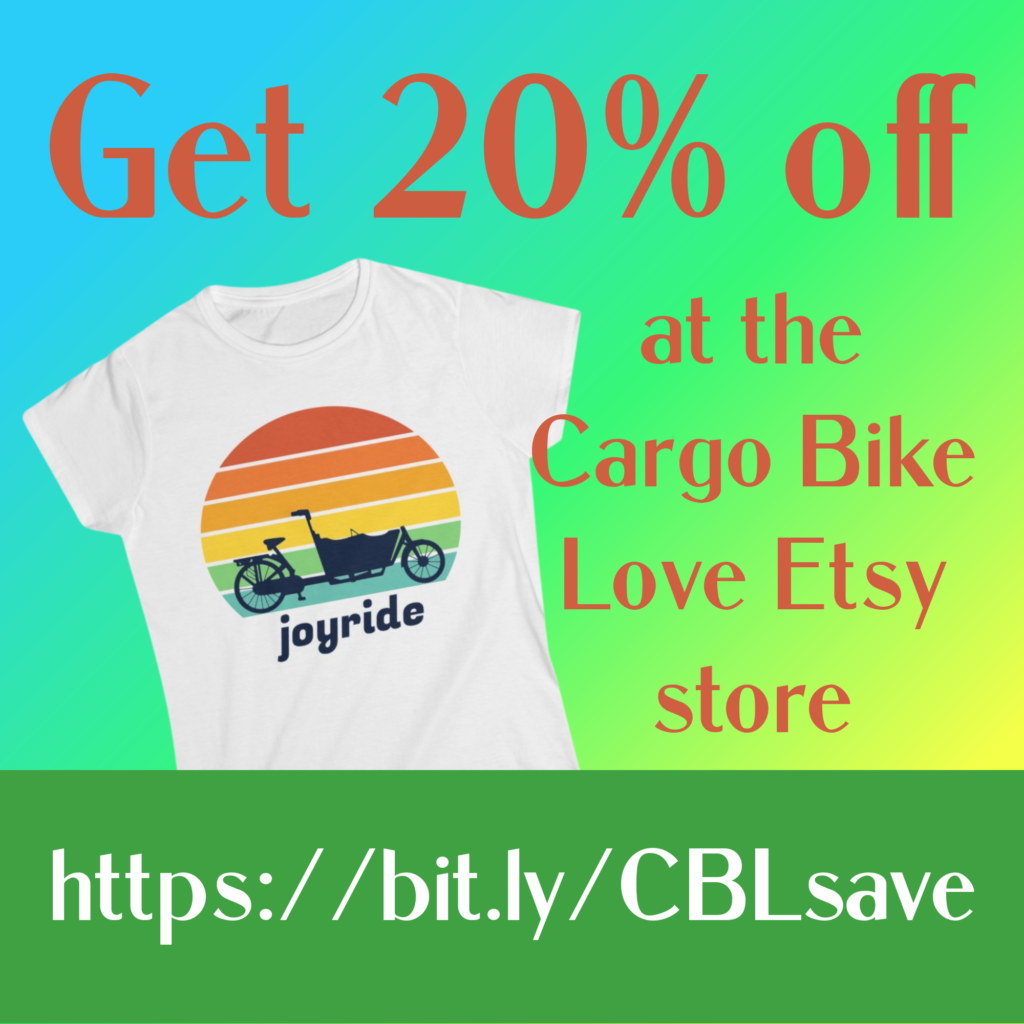 graphic with a white tee shirt featuring a retro style rainbow sunset with a bakfiets style cargo bike silhouetted in front, and the text Get 20% off at the Cargo Bike Love Etsy store and the link https://bit.ly/CBLsave on a green rectangle at the bottom of graphic